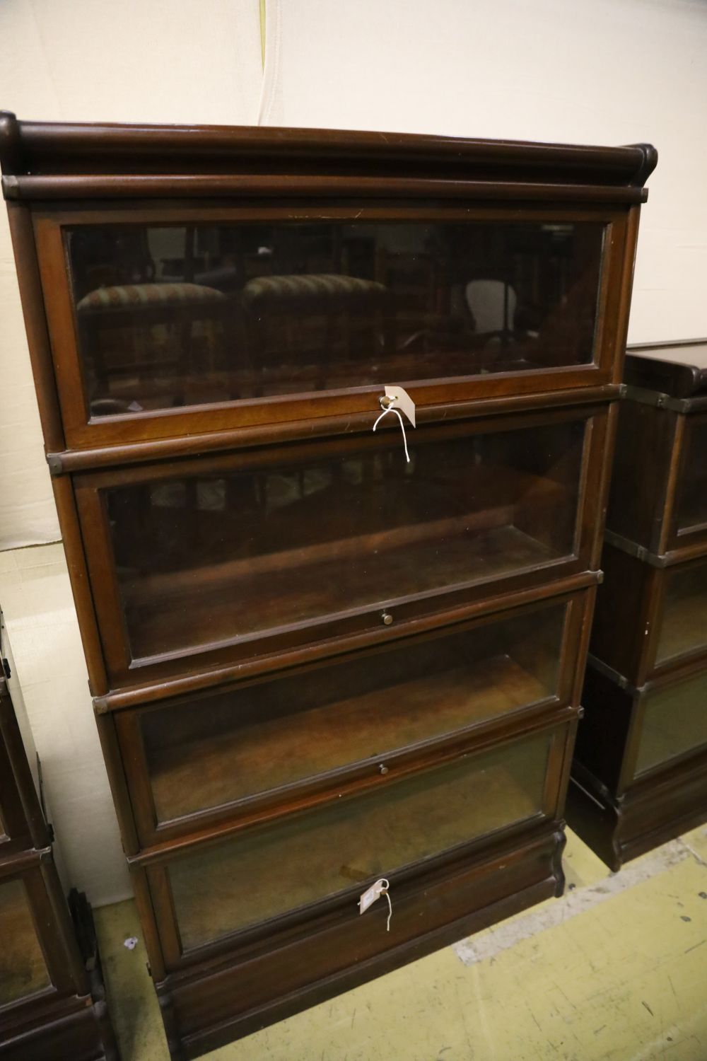 A set of two Globe Wernicke four section mahogany bookcases and a three section Globe Wernicke bookcase, width 86cm, depth 27cm, larges